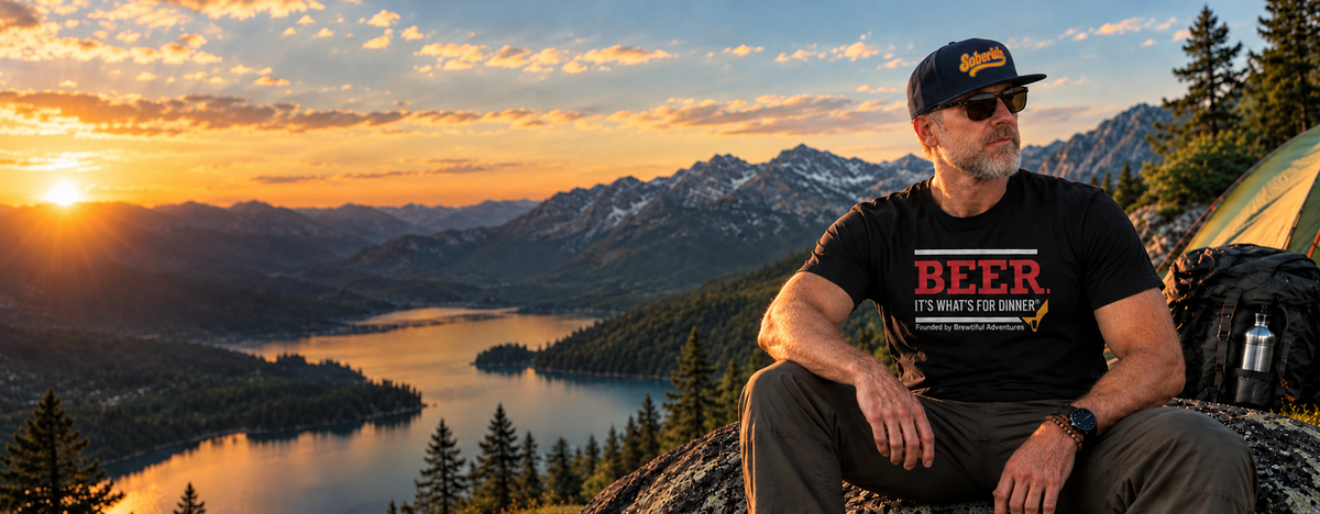 Man enjoying a Brewtiful Adventures T-shirt while relaxing outdoors on an adventure